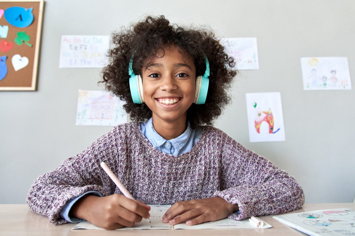 Happy,African,American,Kid,Child,Girl,Wearing,Headphones,Looking,At